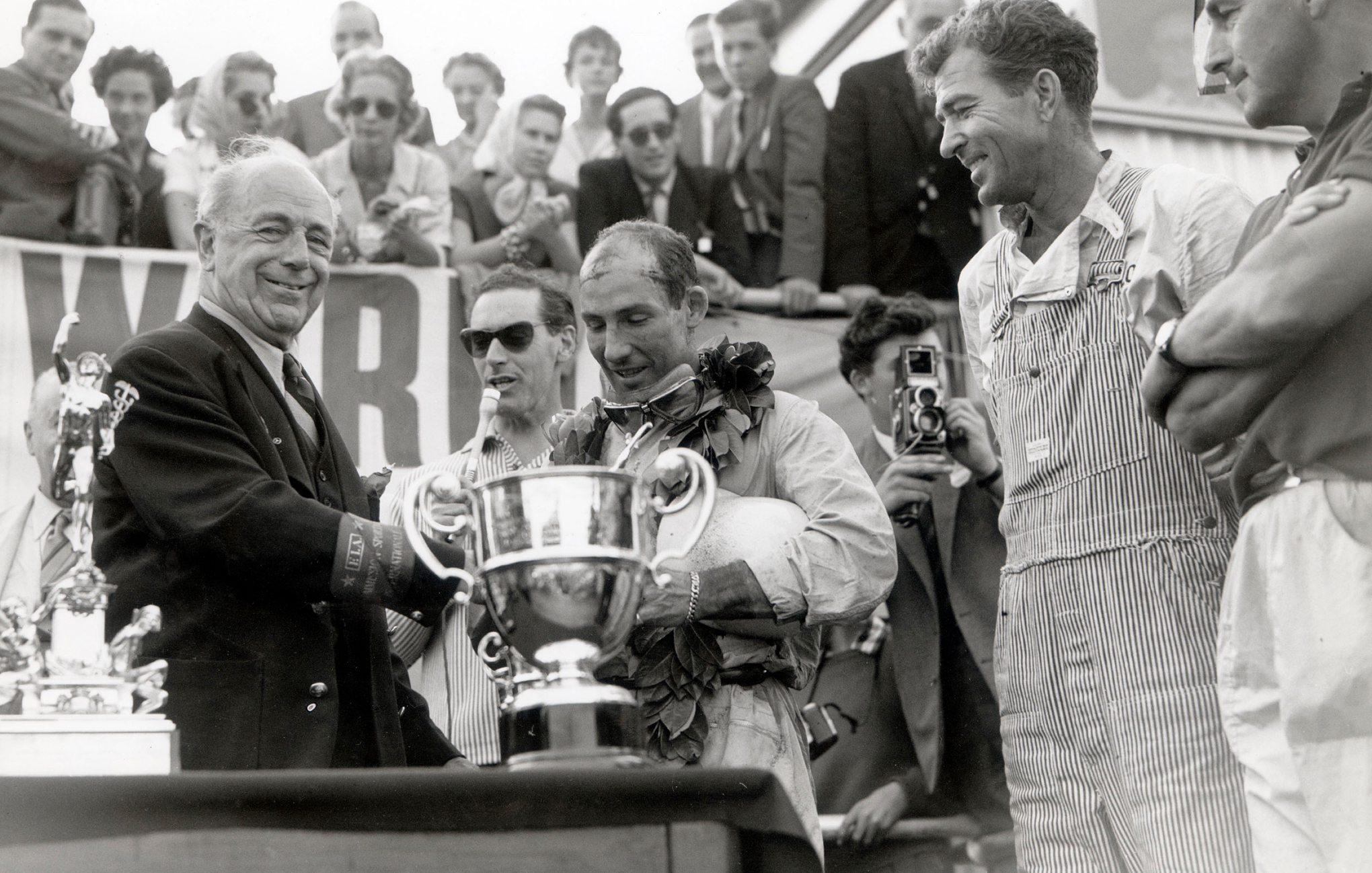 <strong>THE YEARS SPEED BY</strong><br/><span>A look at Goodwood down through the years, including the moment Stirling Moss and Carroll Shelby shared the stage during the victory ceremony</span> 