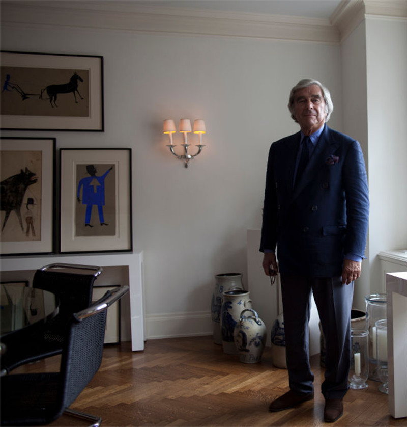 Jerry Lauren in his Manhattan apartment with a selection of Traylor’s works on the wall behind him